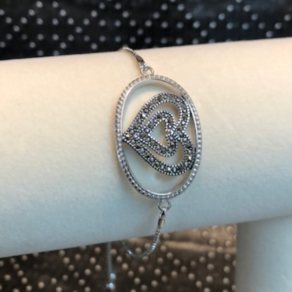 Heart bracelet - silver tone with dangling clasp. Easy on and easy off!